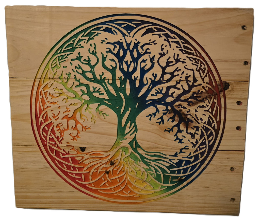 Rainbow tree of life design carved into a wooden panel, featuring vibrant colors and intricate detailing.