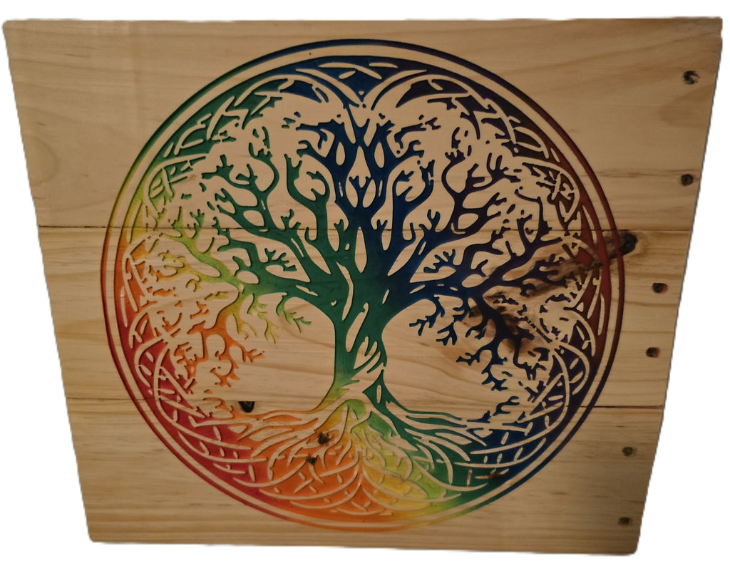 Rainbow tree of life design carved on wood, featuring intricate branches and roots in vibrant colors of green, blue, and o...