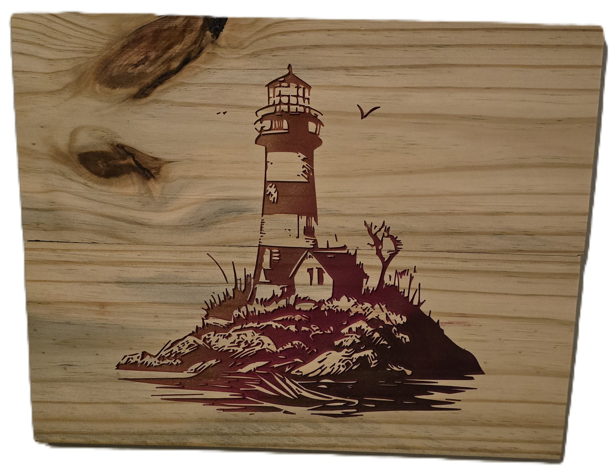 Lighthouse design engraved on wood, featuring a rocky island and water reflection, with a natural wood grain background.