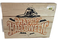 Wooden sign featuring "Happy Halloween" in orange text, with a witch's hat and bats, on a light wood background.