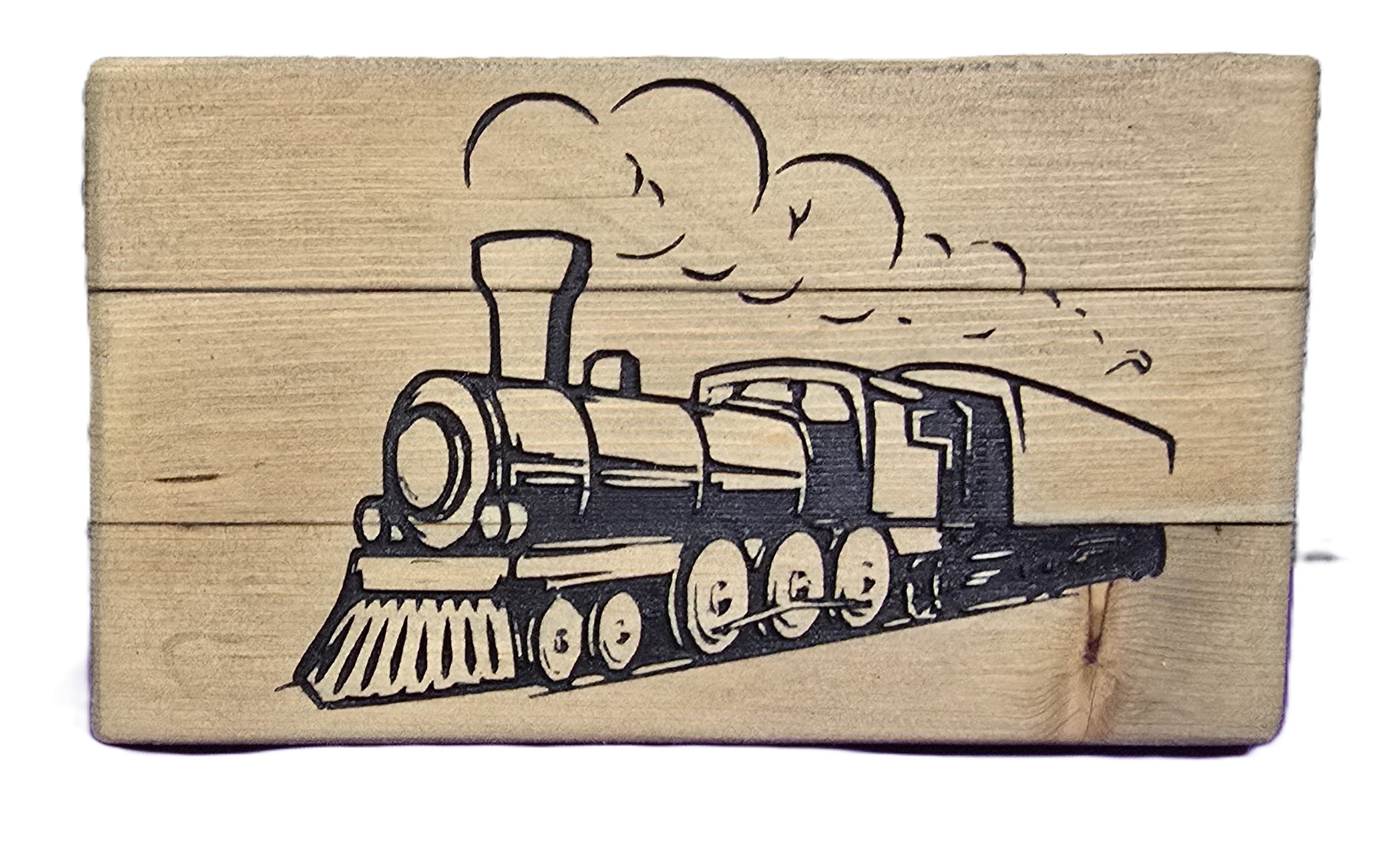 Wooden block featuring a detailed engraving of a vintage steam train with smoke clouds.