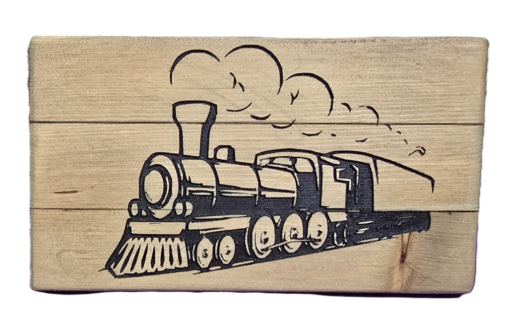 Wooden block featuring a black and white illustration of a vintage steam train with smoke clouds.