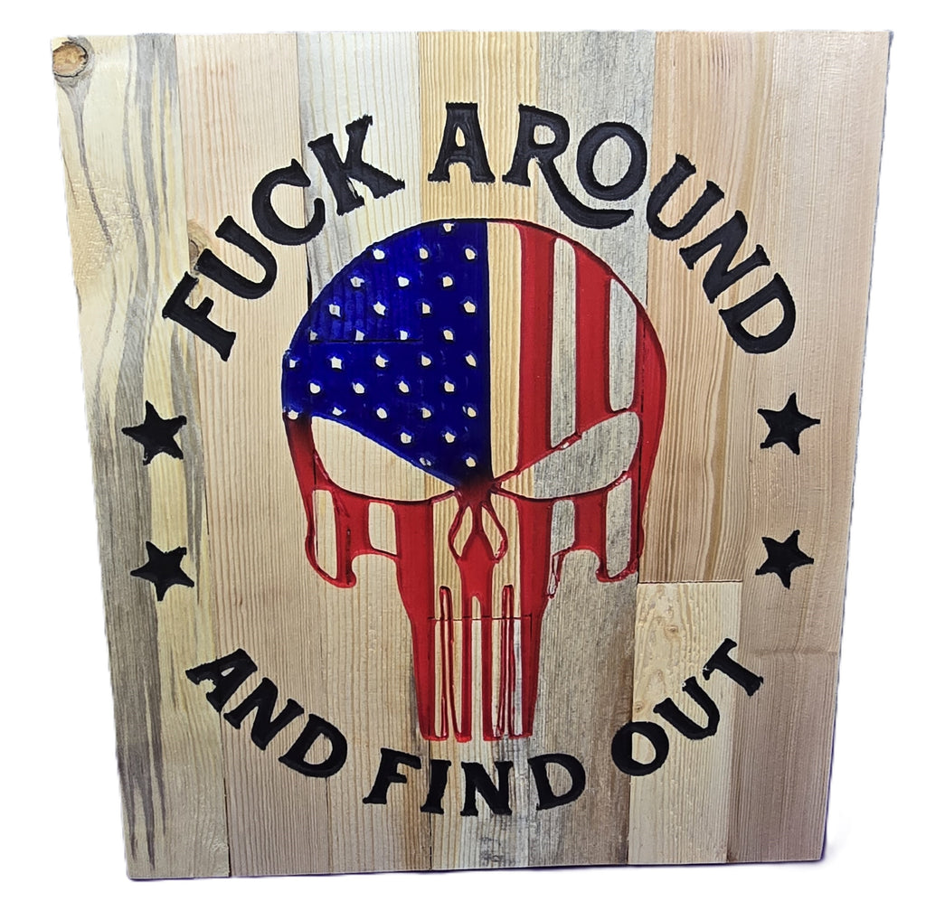 Wooden sign featuring a skull design with an American flag, text reads "Fuck around and find out.