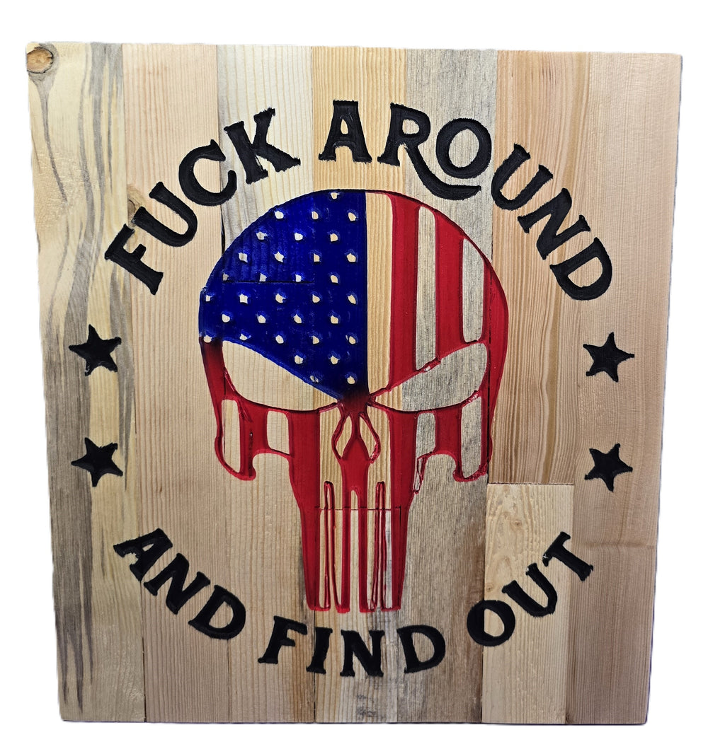 Wooden sign featuring a skull design with an American flag, text reads "Fuck around and find out.