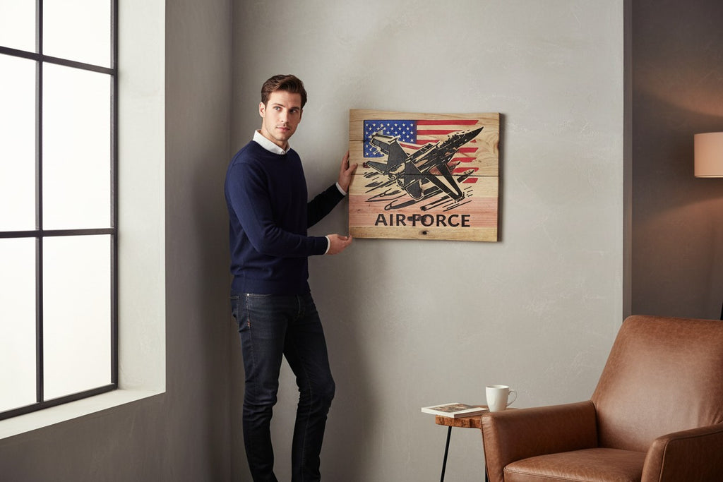 TK Wood Designs wooden sign featuring a black silhouette of an F-18 fighter jet flying over a distressed American flag and the words AIR FORCE.