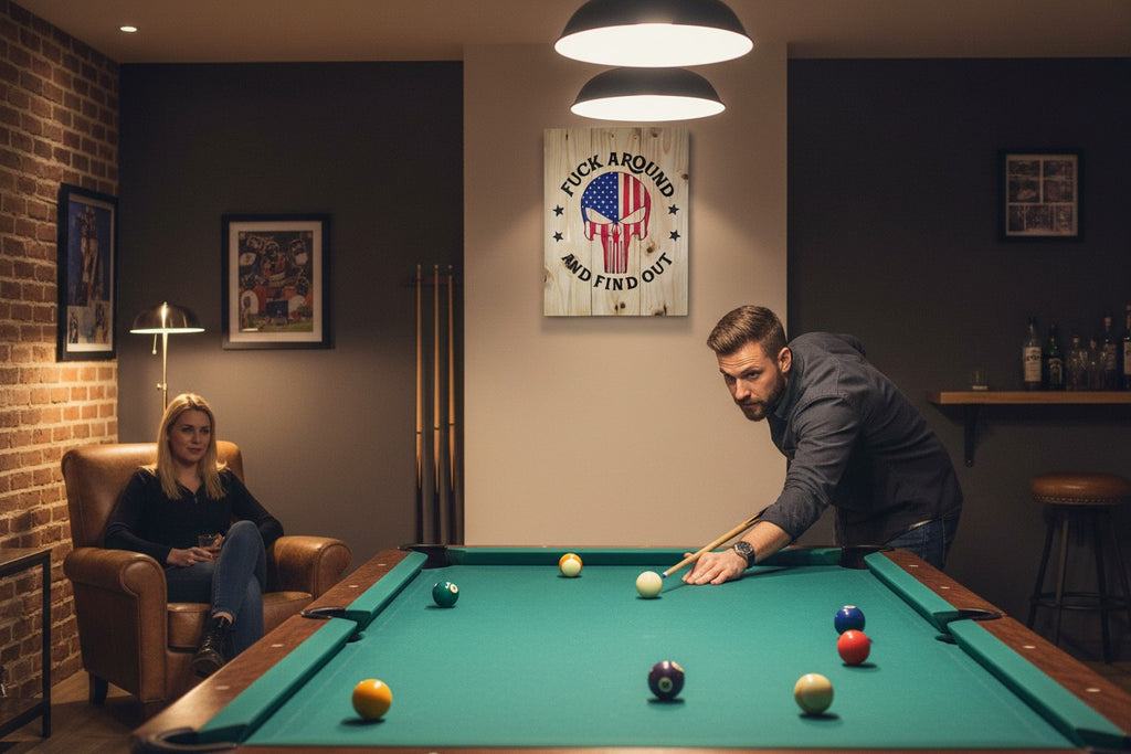 TK Wood Designs handcrafted wooden wall sign with American flag skull graphic hanging in a rustic home game room.