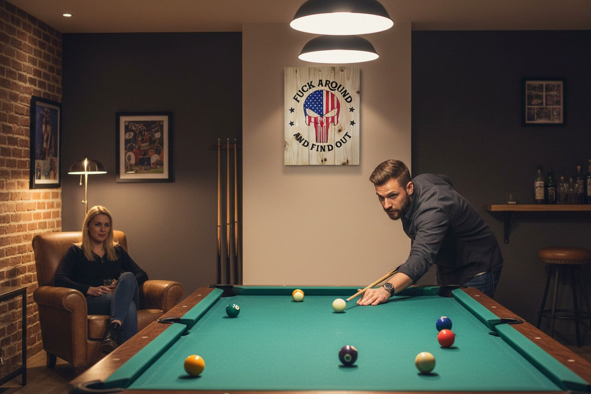 TK Wood Designs handcrafted wooden wall sign with American flag skull graphic hanging in a rustic home game room.