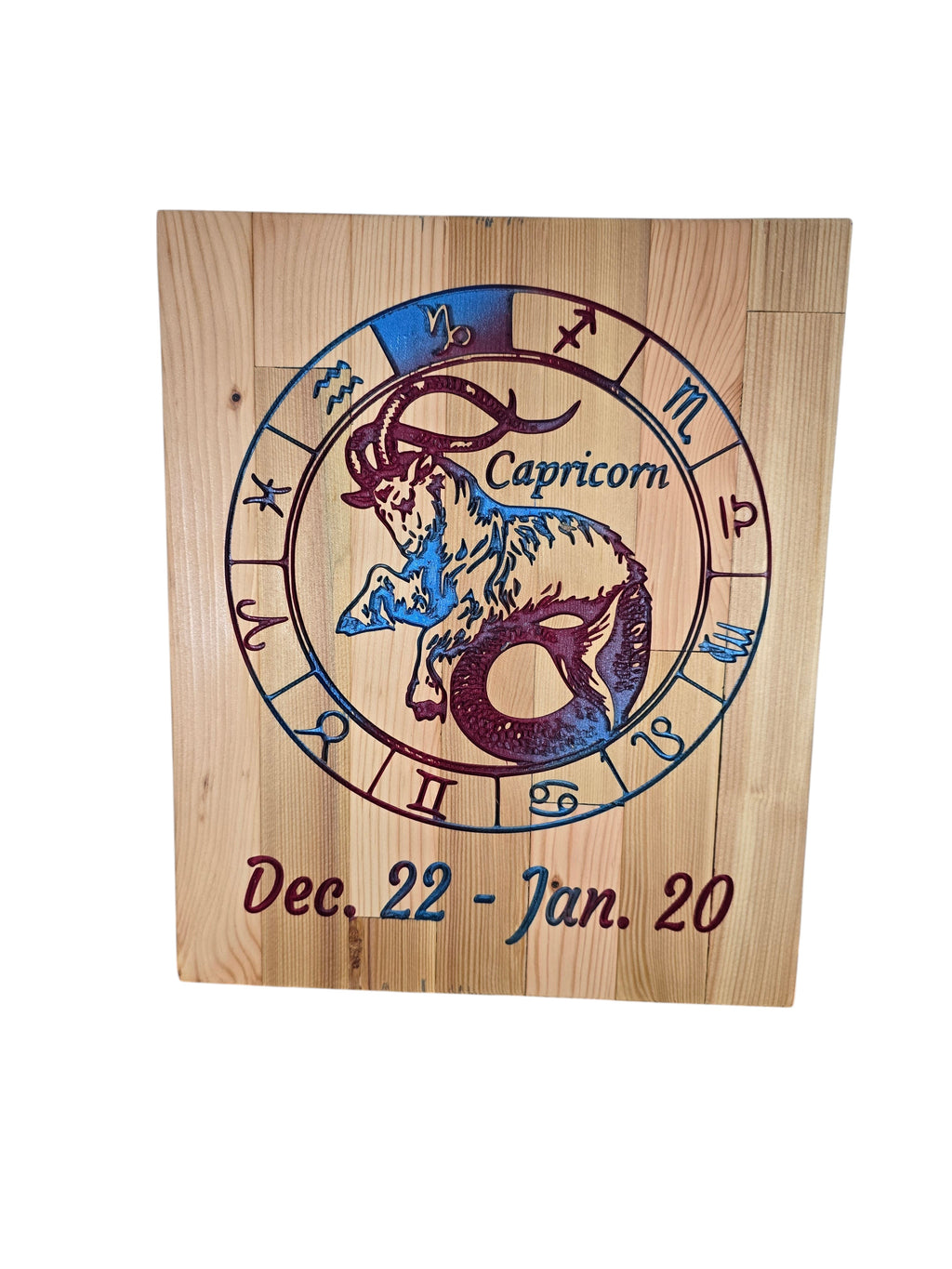 TK Wood Designs Capricorn zodiac wall art featuring a sea-goat engraving on natural wood with blue and purple accents.