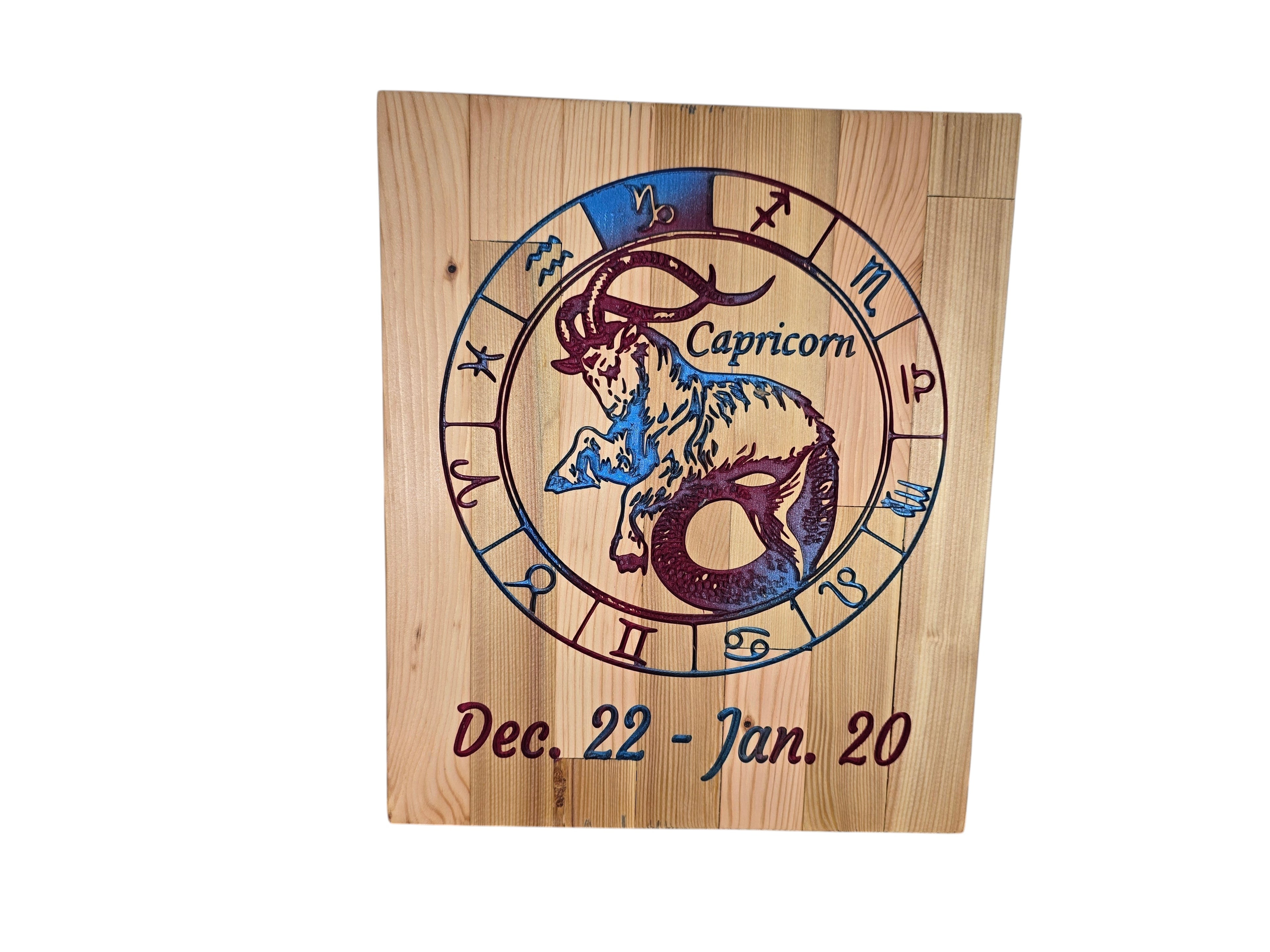 TK Wood Designs Capricorn zodiac wall art featuring a sea-goat engraving on natural wood with blue and purple accents.
