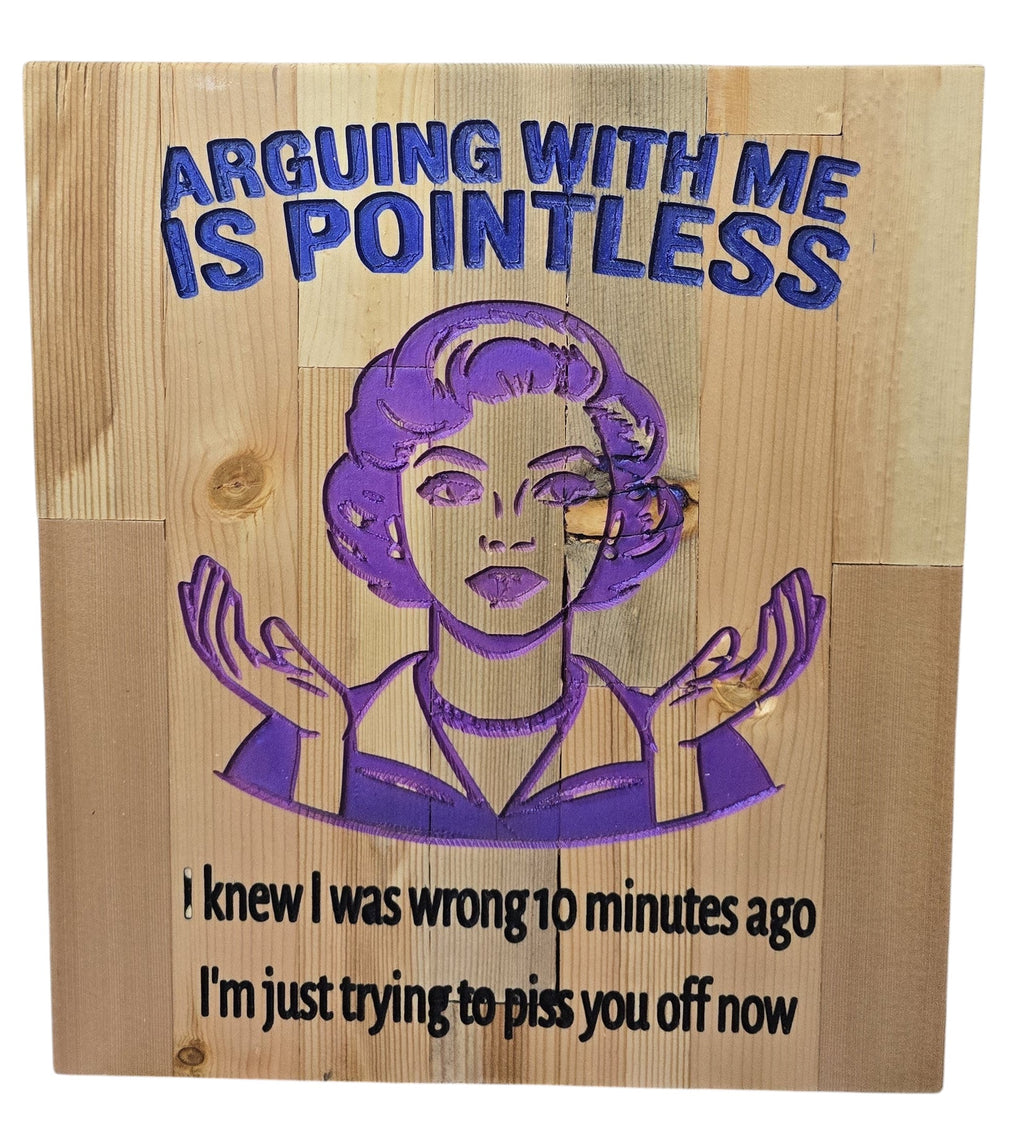 TK Wood Designs carved wood sign with purple text and image of a woman saying "Arguing with me is pointless. I knew I was wrong 10 minutes ago, I'm just trying to piss you off now."