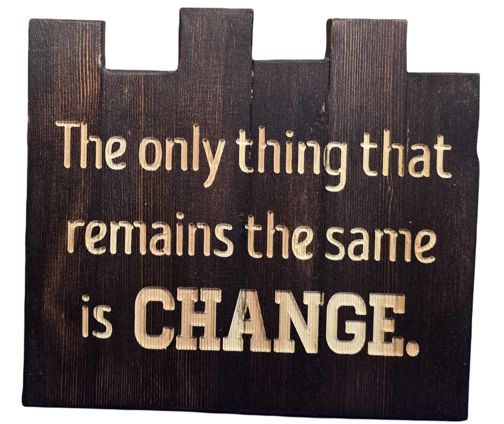 TK Wood Designs dark wood sign with carved text: "The only thing that remains the same is CHANGE."
