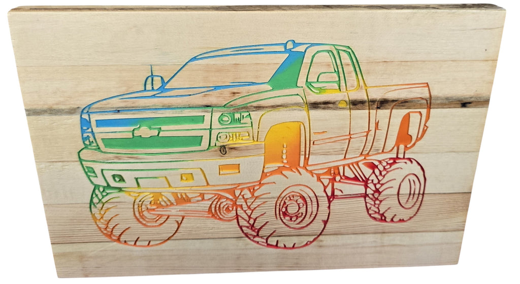 TK Wood Designs wooden sign featuring a carved rainbow-colored Chevy pickup truck with large tires. Rustic Americana decor.