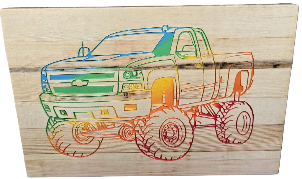 TK Wood Designs handcrafted wooden sign featuring a rainbow-colored Chevy pickup truck silhouette with large monster truck tires.