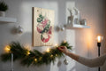 TK Wood Designs rustic wood wall plaque featuring Christmas ornament and poinsettia illustration on a festive wall.