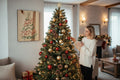 TK Wood Designs rustic salvaged wood Christmas tree sign with red and green painted details. Farmhouse holiday decor.