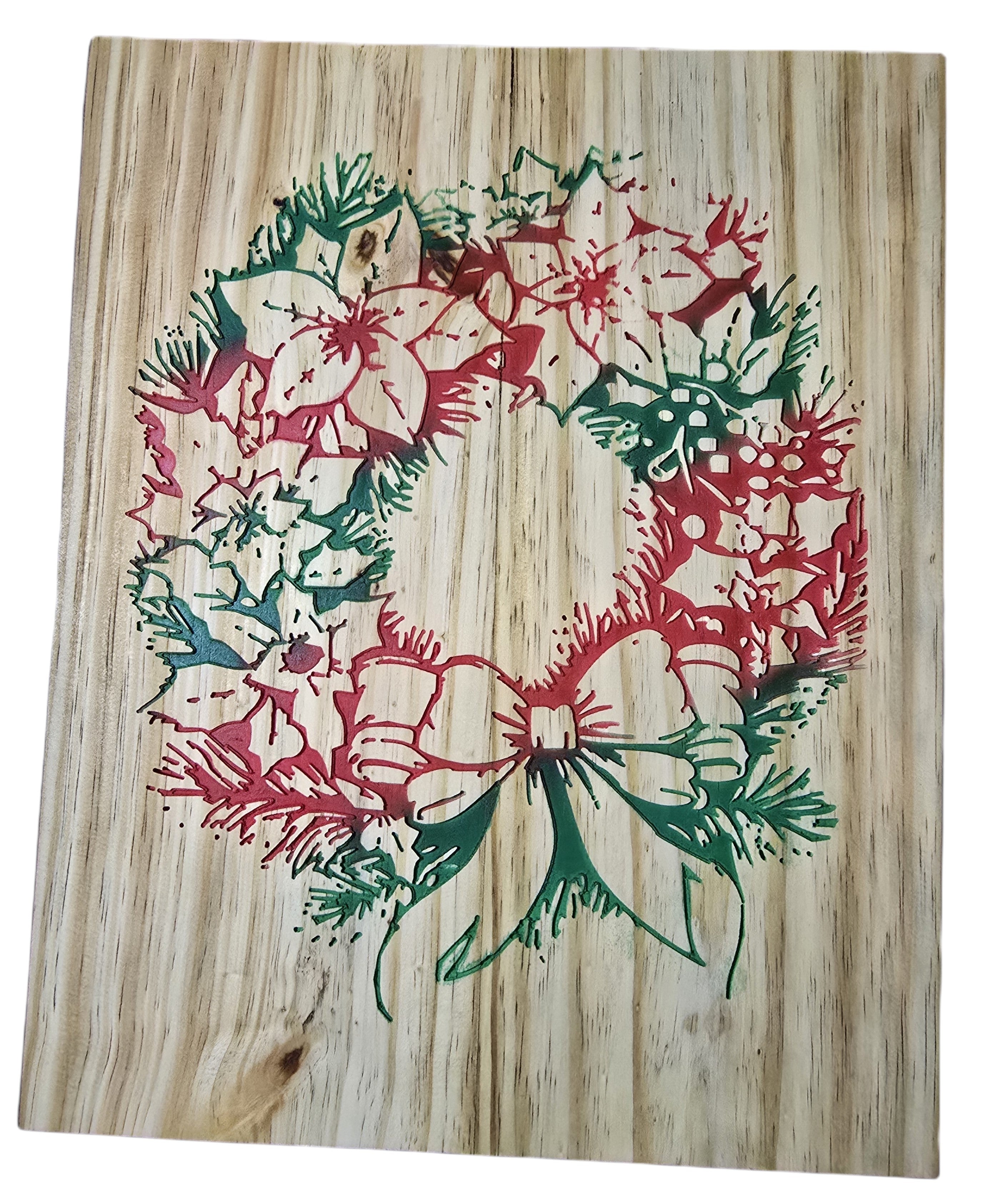 TK Wood Designs rustic Christmas wreath carved into wood, featuring red poinsettias, green pine needles, and a green bow.