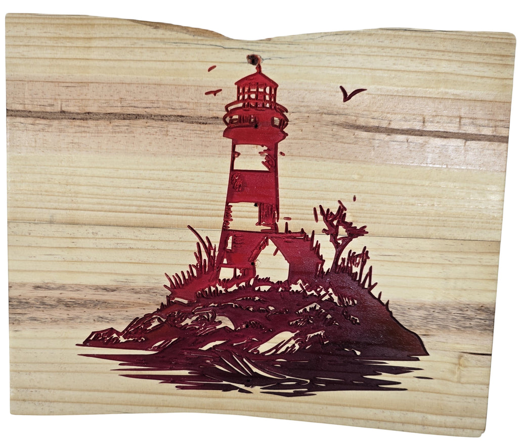 TK Wood Designs natural wood art featuring a red lighthouse on a rocky island with seagulls. Coastal decor.