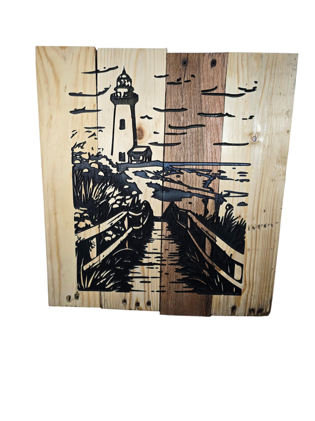 TK Wood Designs wooden wall art featuring a lighthouse scene etched on natural wood planks. Coastal decor.