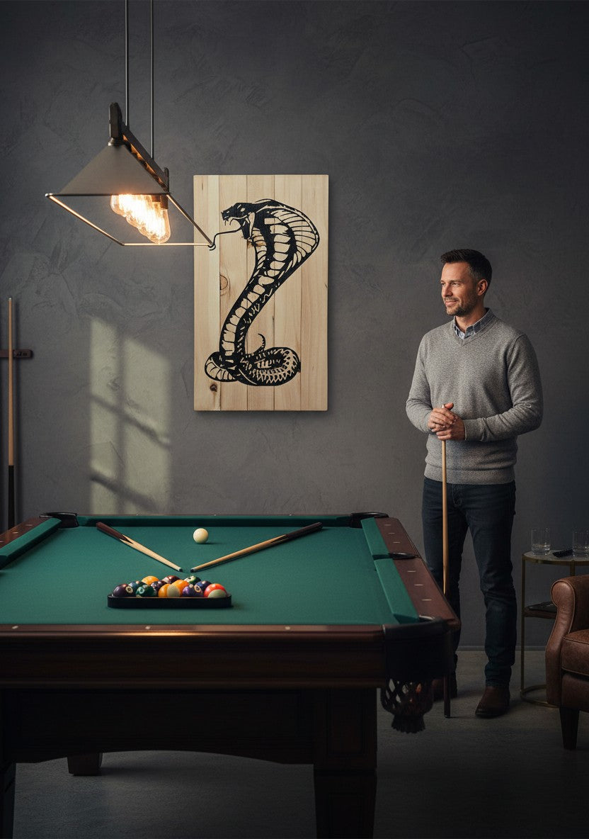 TK Wood Designs black cobra wood wall art on natural wood planks, featuring a coiled cobra silhouette.