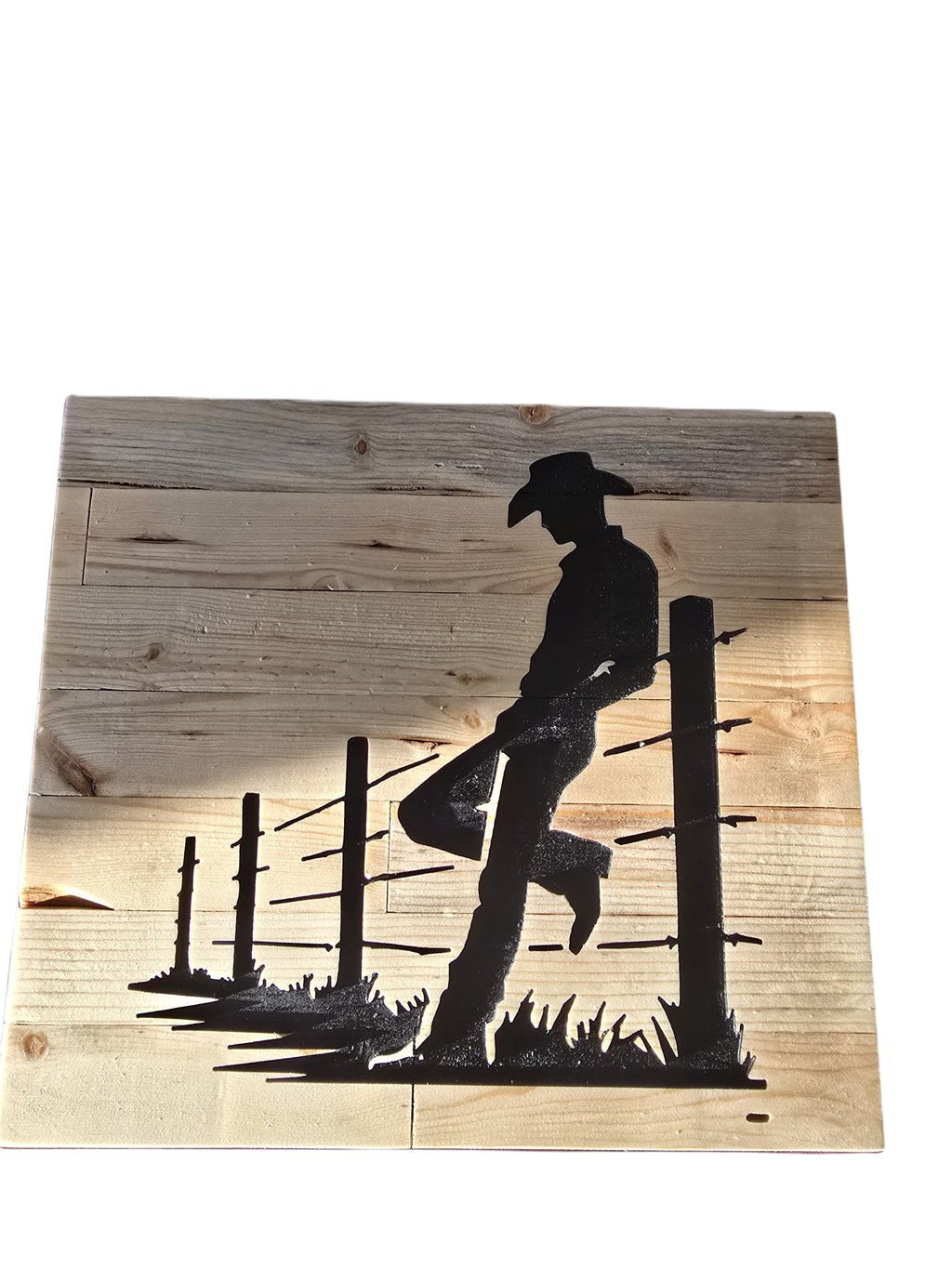 TK Wood Designs rustic wooden sign featuring a black silhouette of a cowboy leaning on a fence, with distressed wood planks.