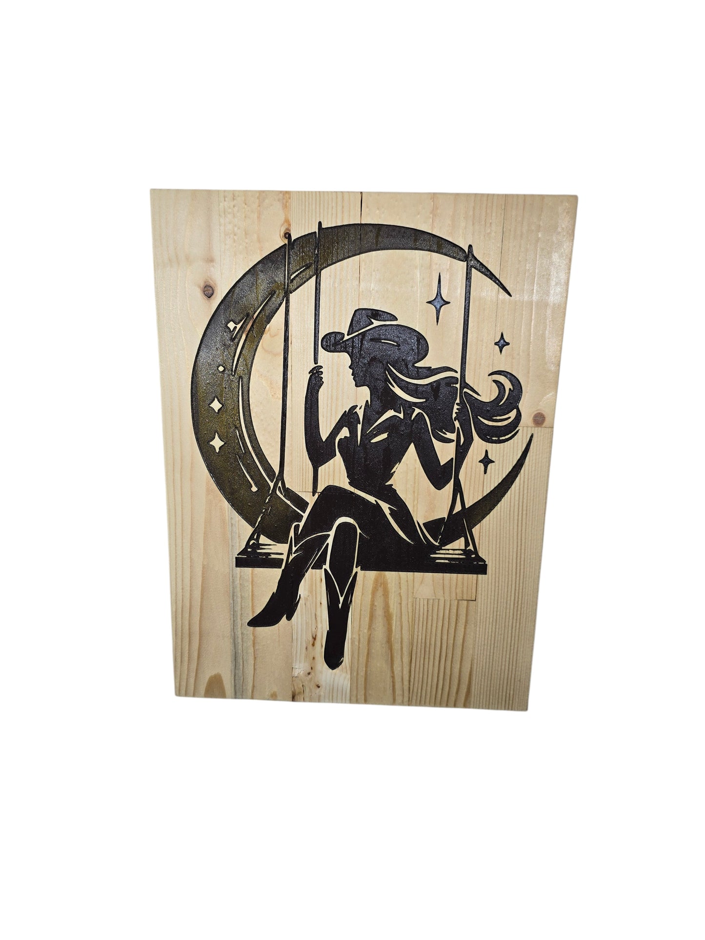 TK Wood Designs rustic wood sign with a silhouette of a cowgirl on a swing against a crescent moon and stars.