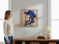 TK Wood Designs rustic wall art featuring a blue cowgirl silhouette on reclaimed wood, displayed in a modern home.