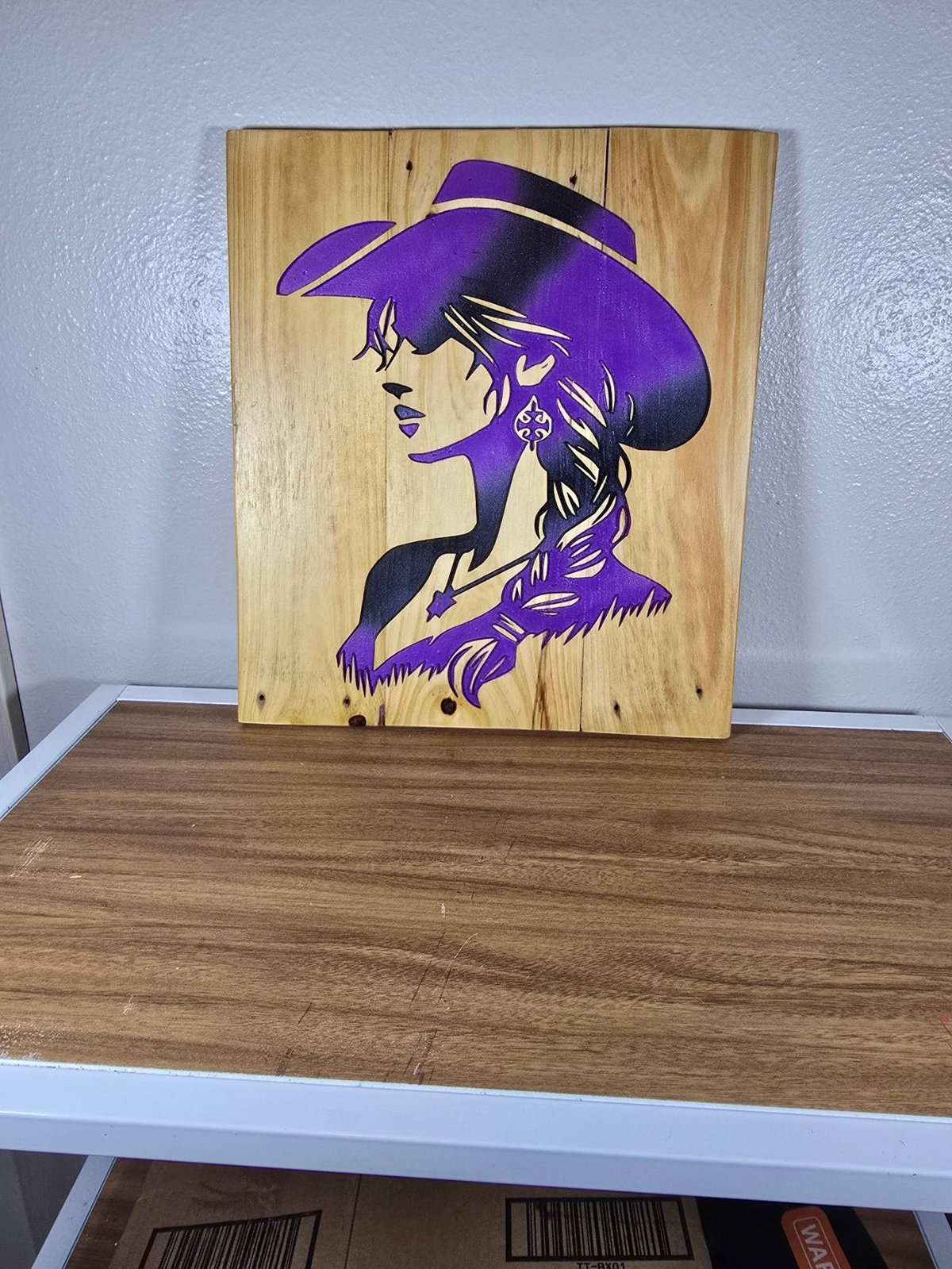 TK Wood Designs handcrafted wooden sign featuring a purple and black silhouette of a cowgirl in a cowboy hat