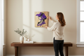 TK Wood Designs handcrafted wooden wall art featuring a purple cowgirl silhouette hanging on a neutral living room wall