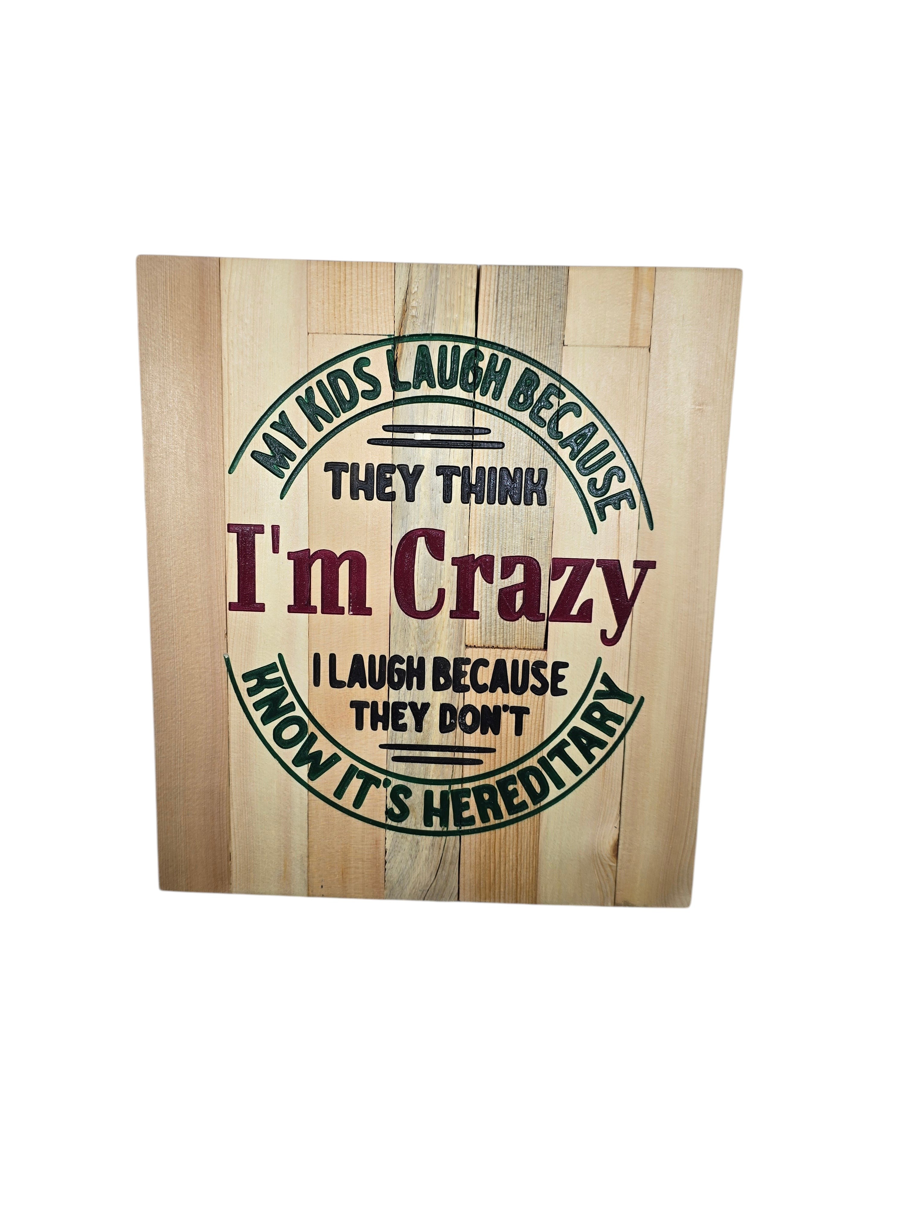 TK Wood Designs wooden sign with "My kids laugh because they think I'm crazy. I laugh because they don't know it's hereditary" quote.