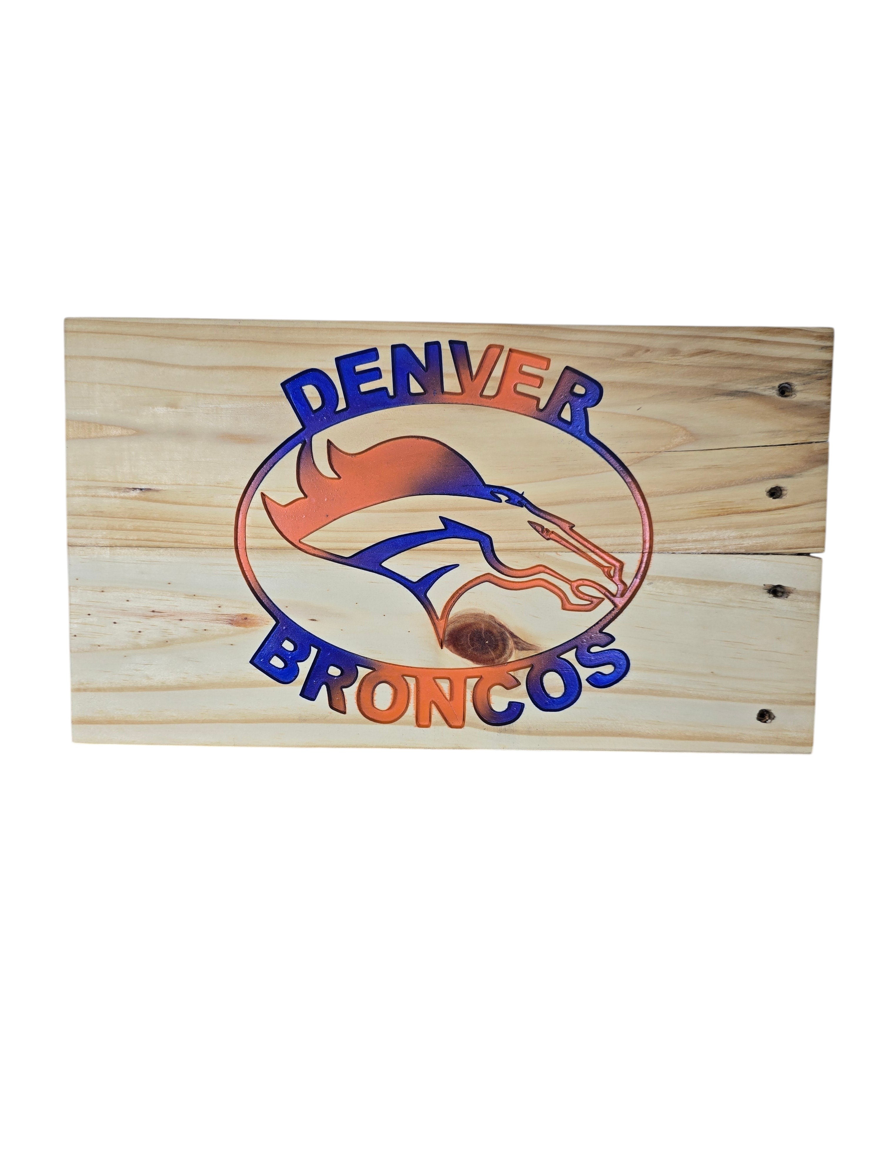 TK Wood Designs handcrafted Denver Broncos wooden wall sign with blue and orange gradient logo on natural wood grain.