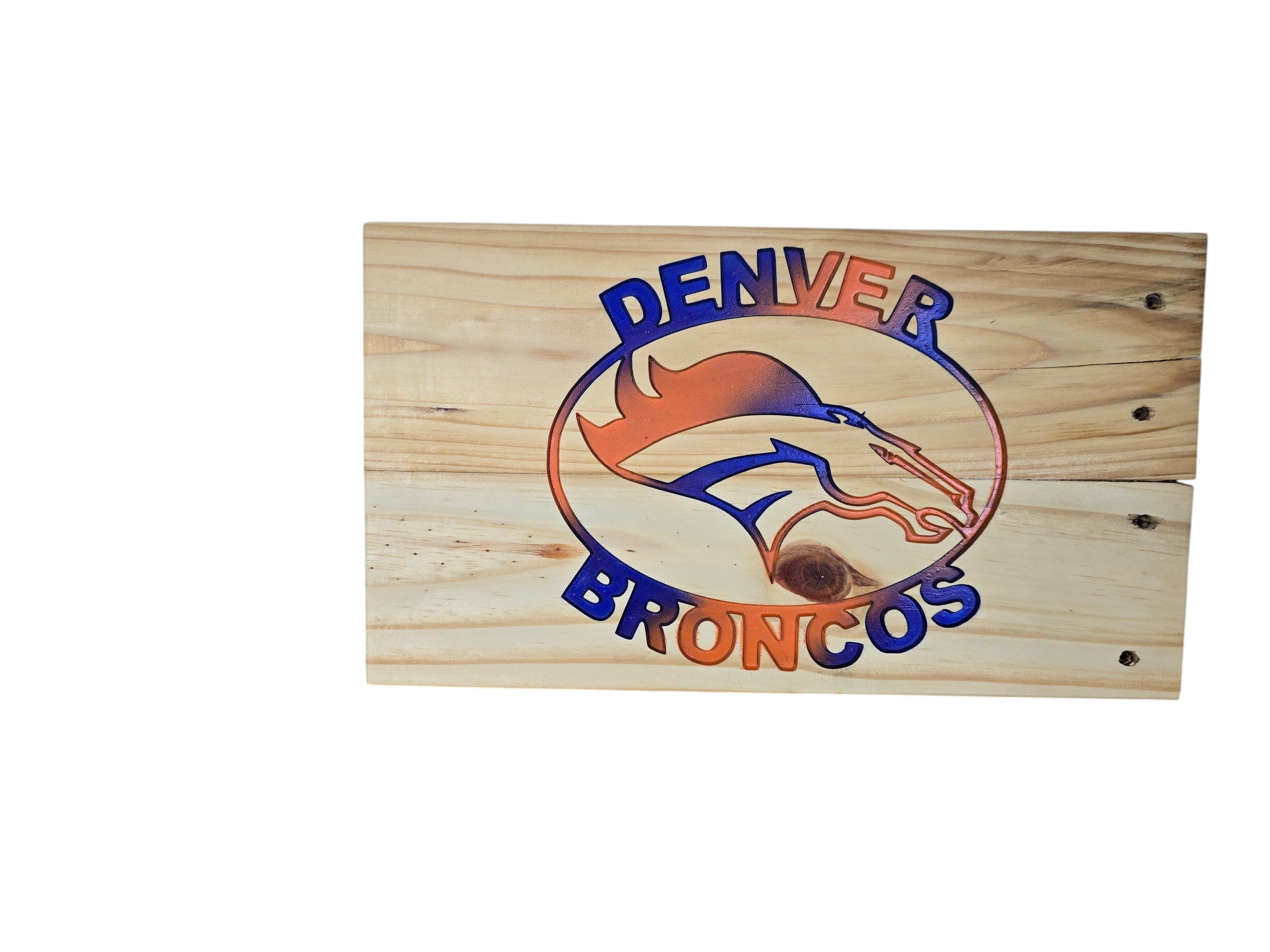 TK Wood Designs handcrafted Denver Broncos wooden wall sign with blue and orange gradient logo on natural wood grain.