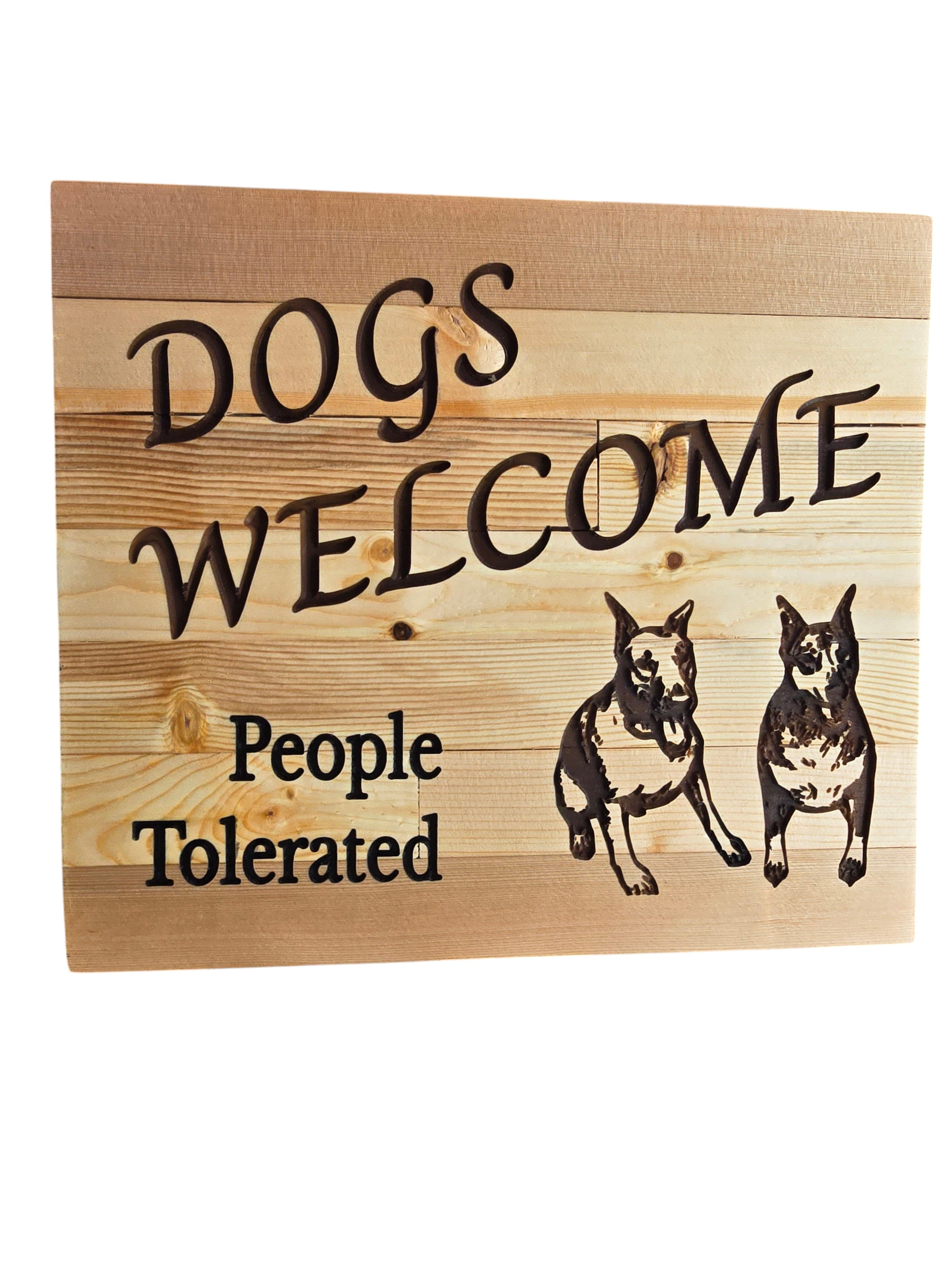 TK Wood Designs wooden sign with carved text "DOGS WELCOME People Tolerated" and two Doberman dog carvings.