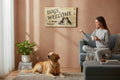 TK Wood Designs wooden sign with "Dogs Welcome, People Tolerated" text and two dog illustrations.