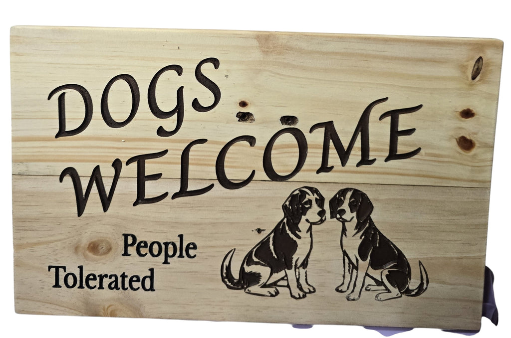 TK Wood Designs wooden sign with "Dogs Welcome, People Tolerated" and two dog illustrations.