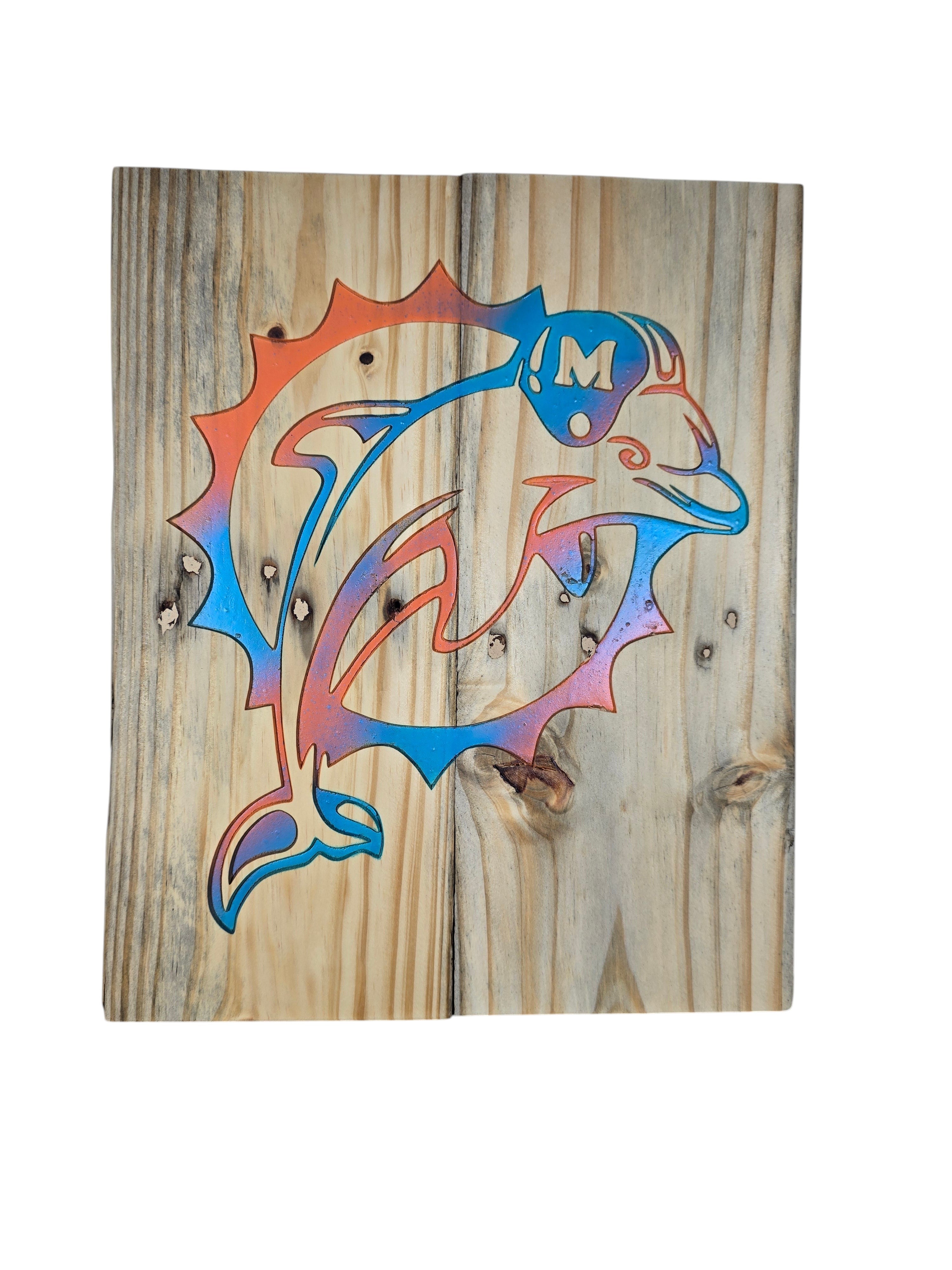 TK Wood Designs rustic wooden wall art featuring an orange and blue dolphin logo on reclaimed-style natural wood.