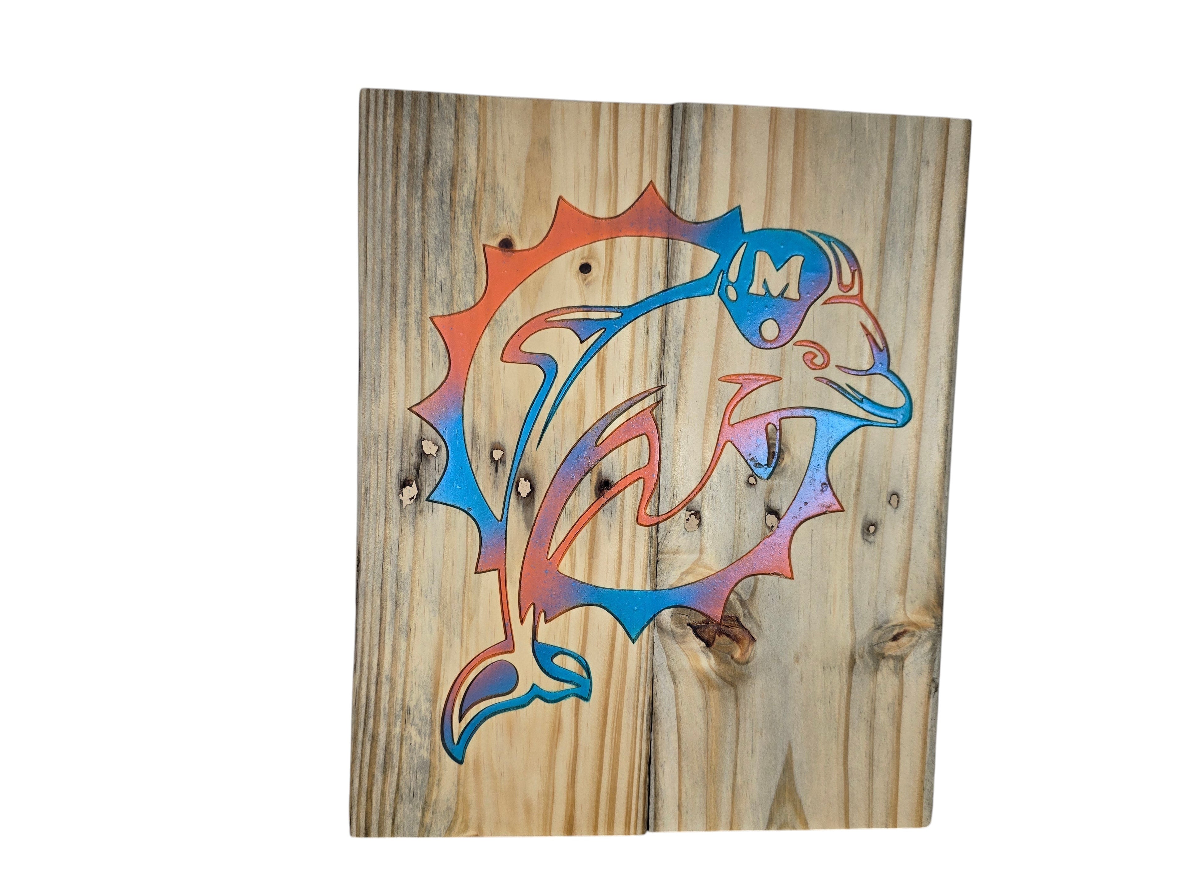 TK Wood Designs rustic wooden wall art featuring an orange and blue dolphin logo on reclaimed wood planks.