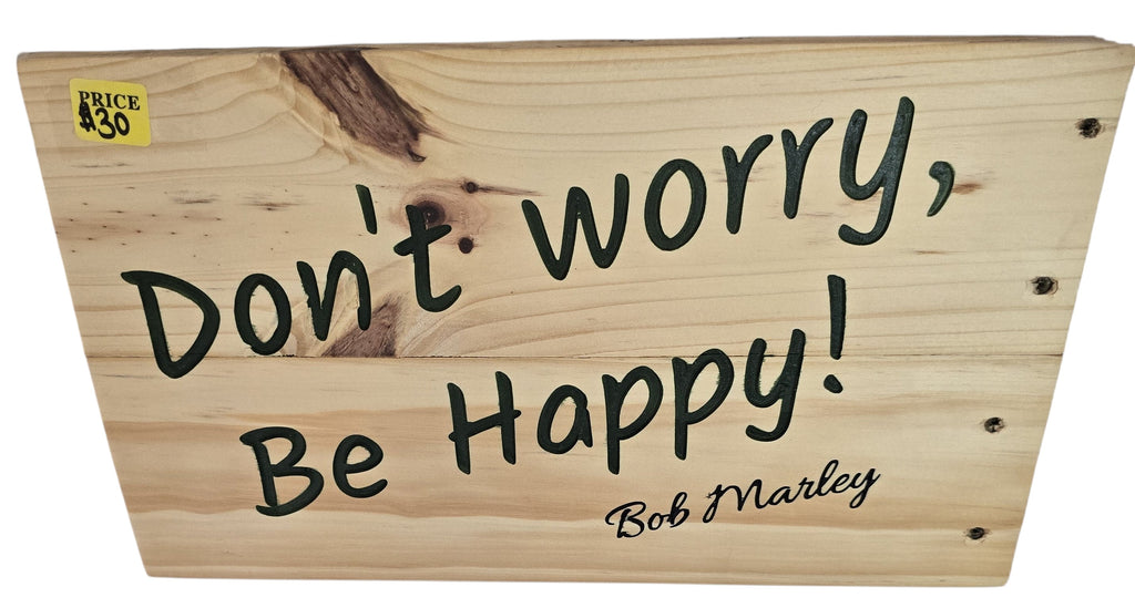 TK Wood Designs natural wood sign with black handwritten-style lettering that reads "Don't Worry, Be Happy! Bob Marley".