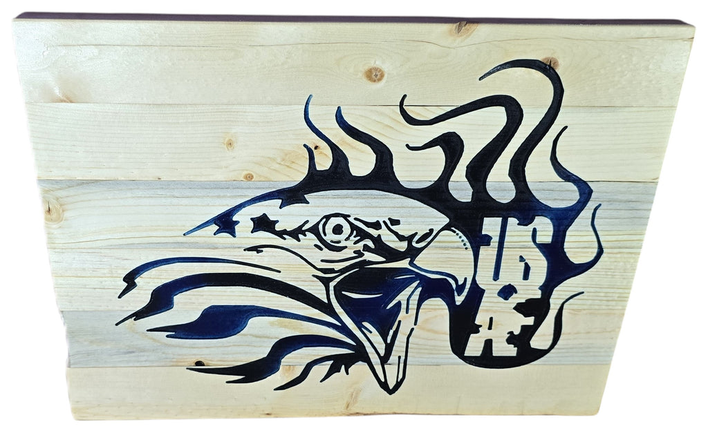 TK Wood Designs rustic wood wall art featuring a navy blue eagle with stars and flames. Natural wood planks.