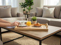 TK Wood Designs wooden serving tray with train depot engraving, holding a coffee cup, orange juice, and a croissant.