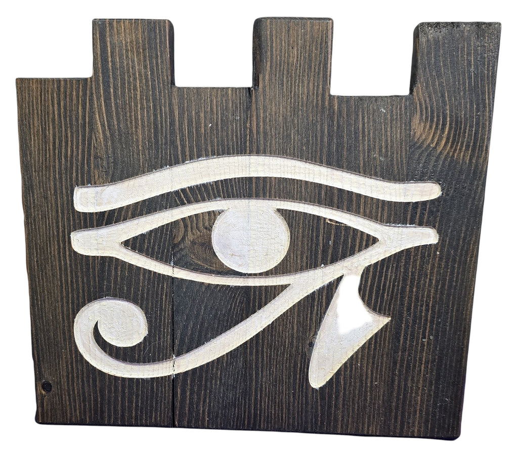 TK Wood Designs hand-painted Evil Eye decor on reclaimed wood. Features a distressed dark wood base and white painted symbol. 9" H x 10" W.