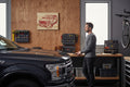 TK Wood Designs F-150 truck carved into natural wood with red detailing. Rustic garage decor.