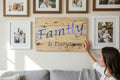 TK Wood Designs wooden sign with "Family Is Everything" in purple and blue watercolor font. 22.25" H x 14" W.