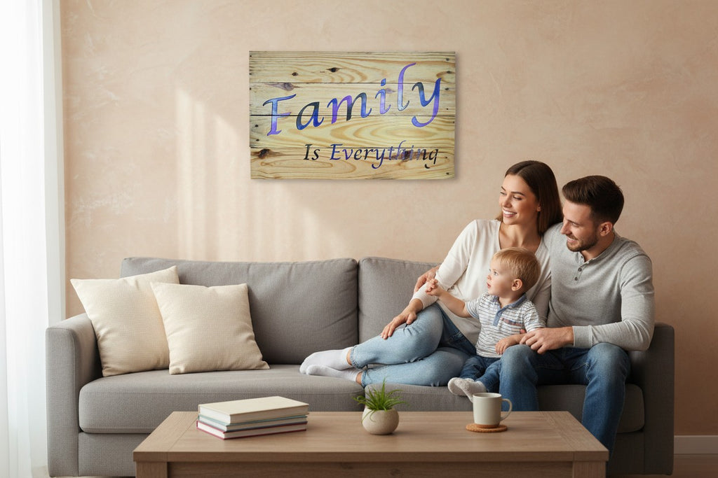 TK Wood Designs Family Is Everything wood wall art sign with blue and purple gradient lettering on rustic planks.