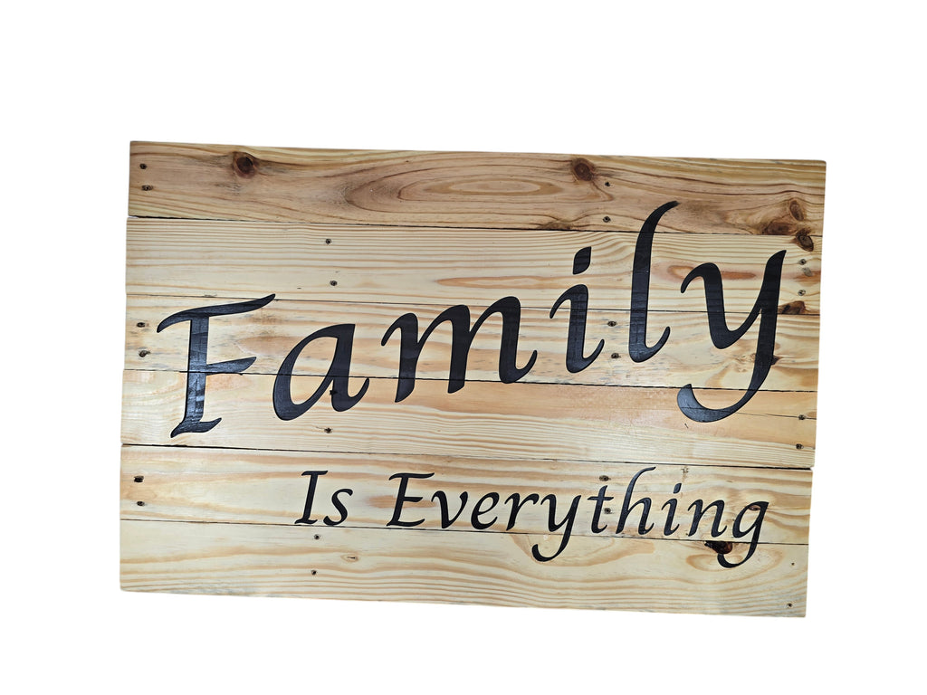 TK Wood Designs Family Is Everything wood wall art sign, natural wood planks with black script font.