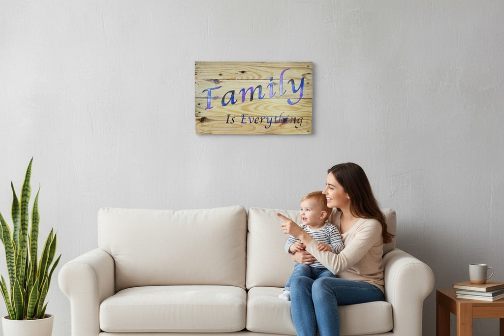 TK Wood Designs Family Is Everything wood wall art sign with blue and purple gradient lettering on rustic planks.