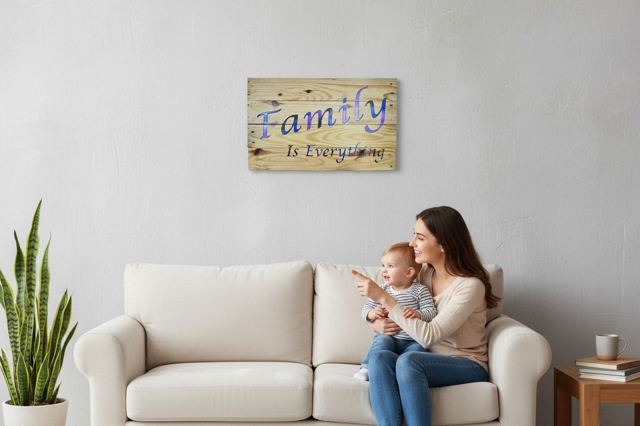 TK Wood Designs Family Is Everything wood wall art sign with blue and purple gradient lettering on rustic planks.