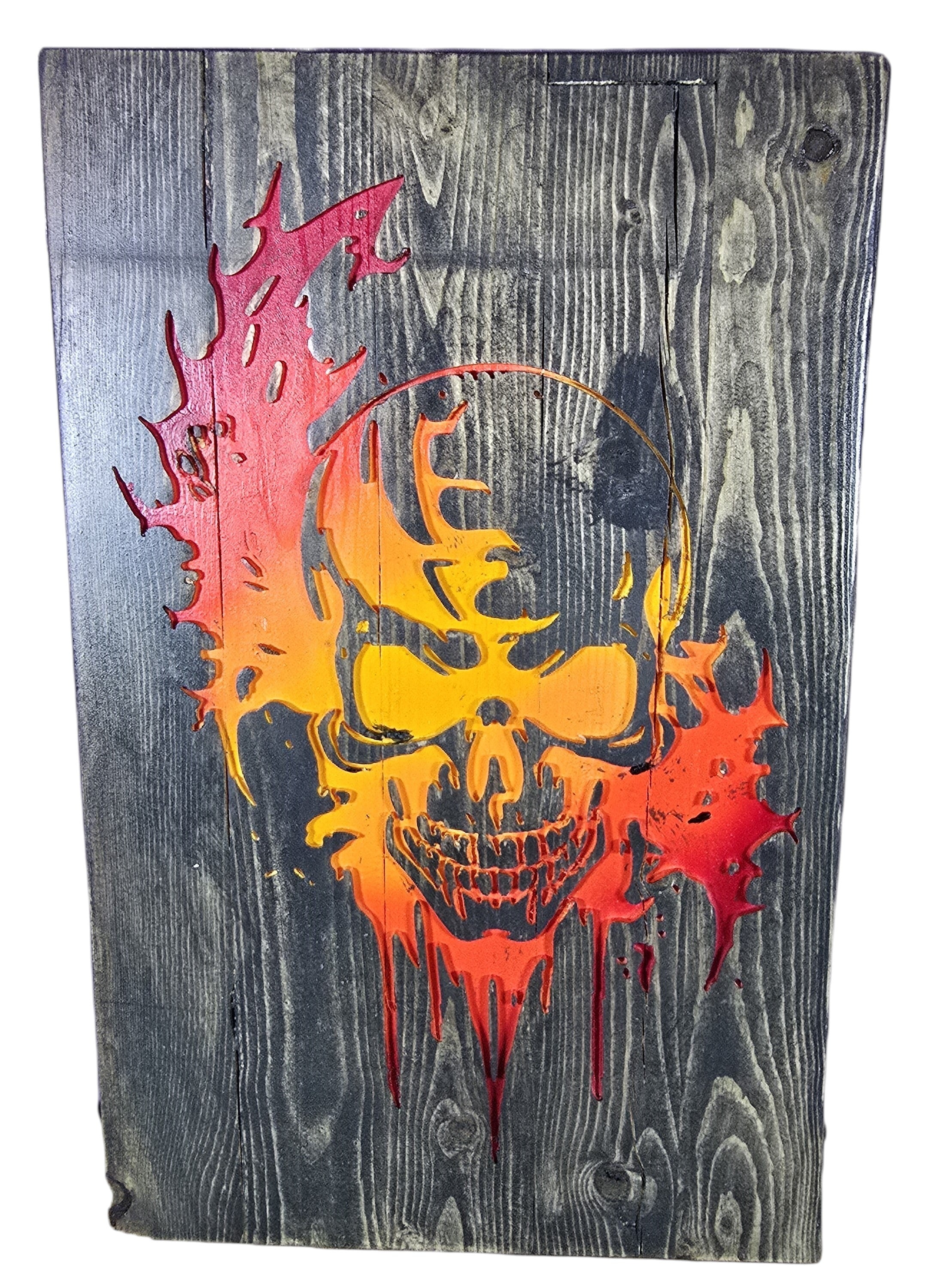 TK Wood Designs distressed wood wall art featuring a fiery skull in red, orange, and yellow. Rustic texture.