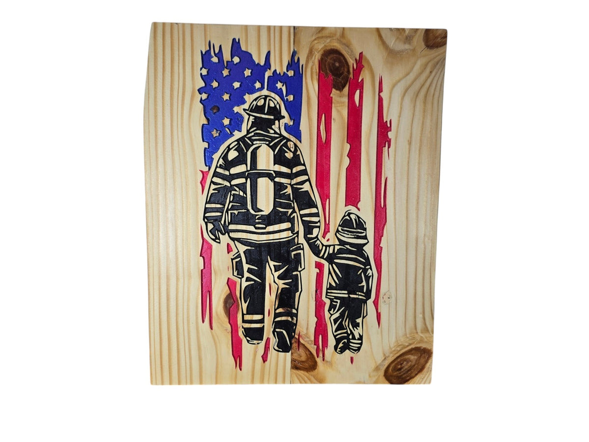 TK Wood Designs handcrafted wooden wall art featuring a firefighter and child silhouette with a distressed US flag.