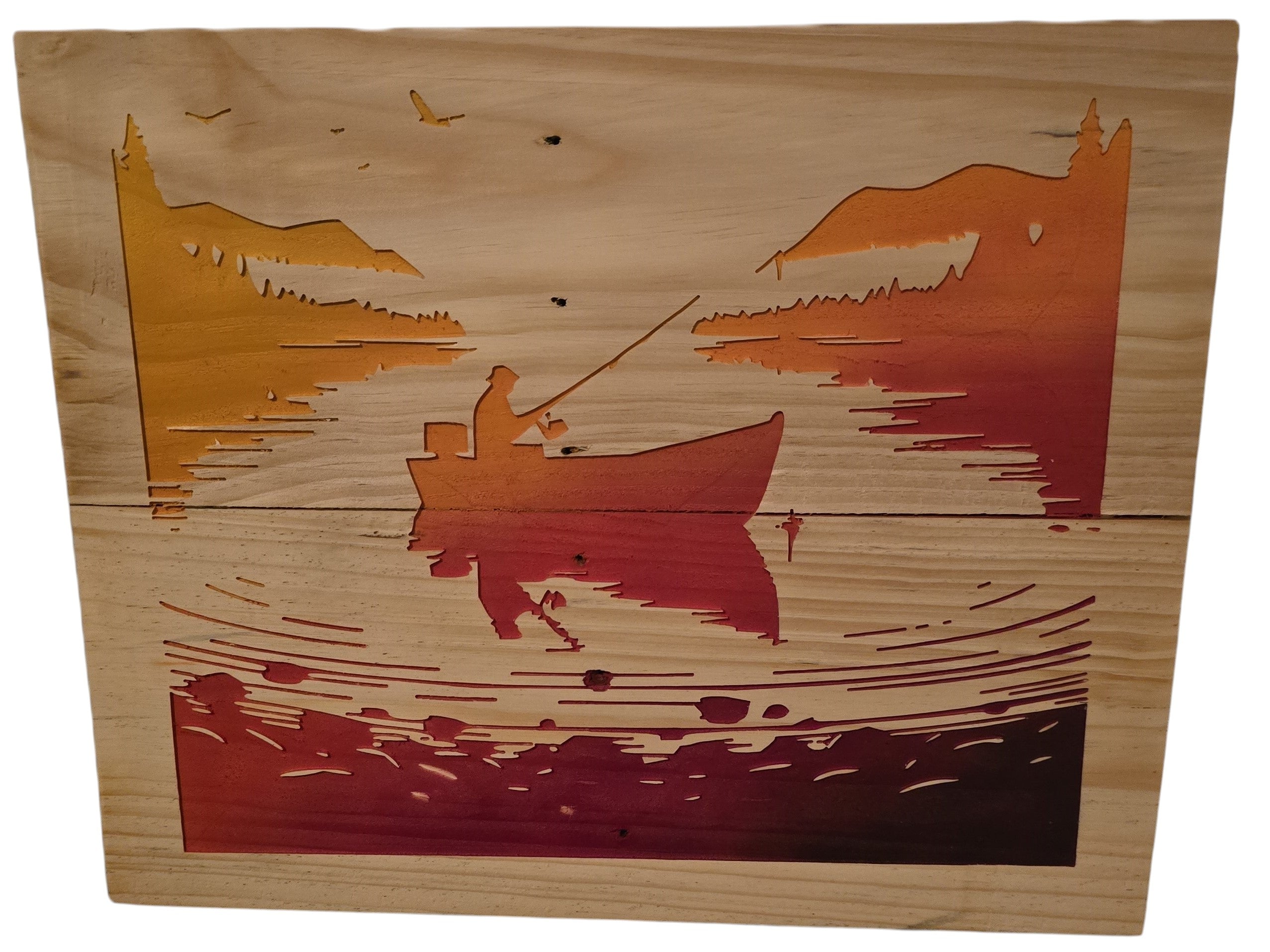 TK Wood Designs wooden wall art depicting a fishing scene with a lone angler in a boat against a gradient sunset.