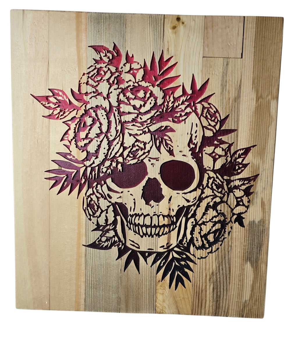 TK Wood Designs wooden wall art featuring a skull adorned with red roses and leaves.
